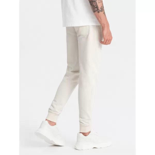  Pánské tepláky OMBRE OM-PABS-0174 CREAM 
